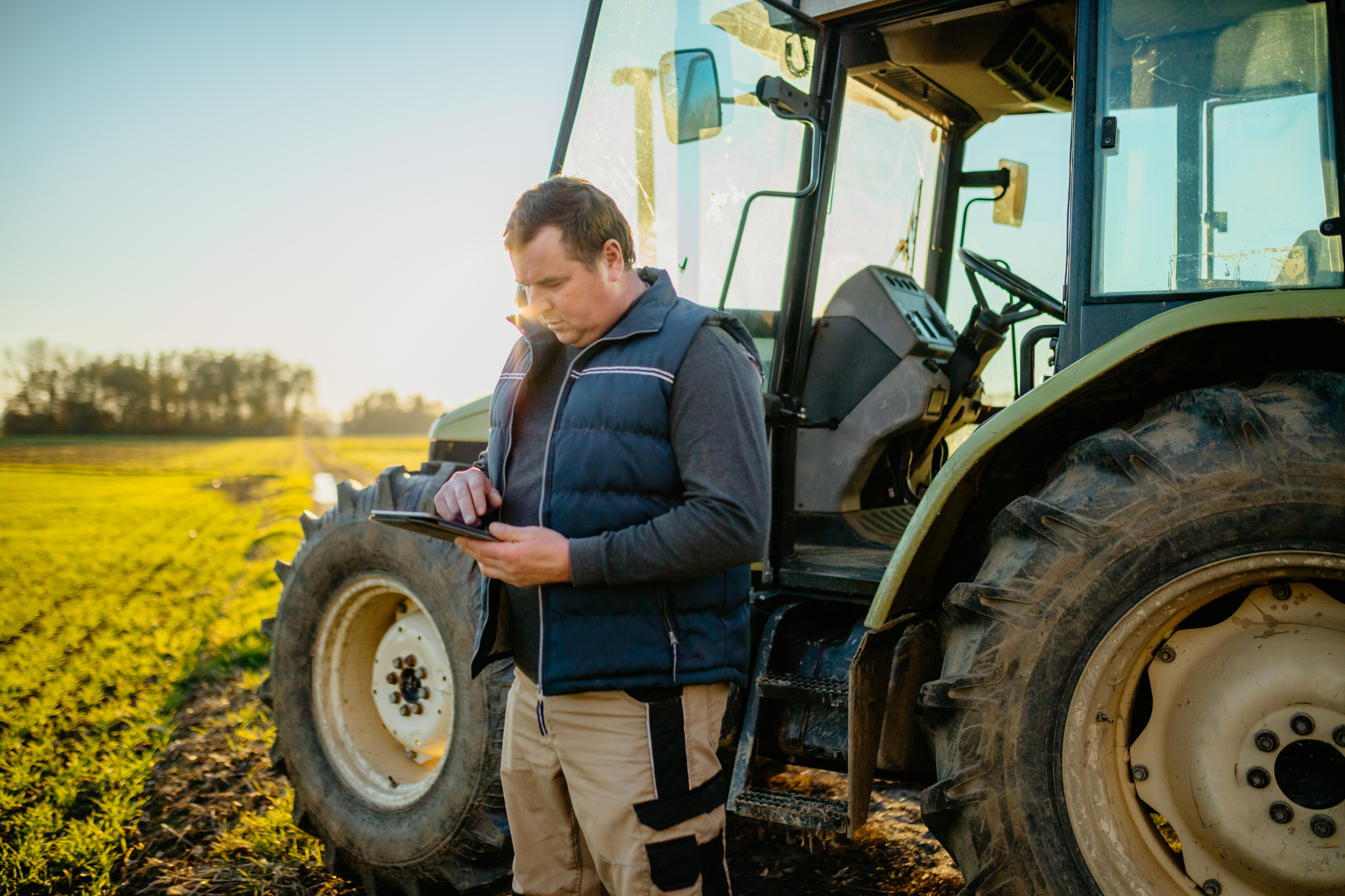 Farmer using digital tablet on field